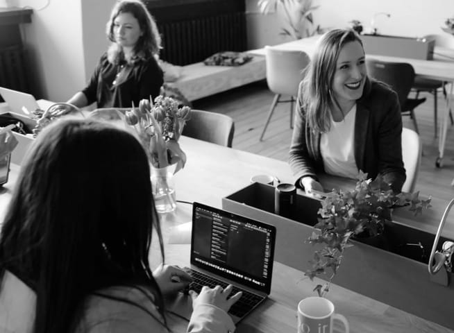 programmers sitting around a table